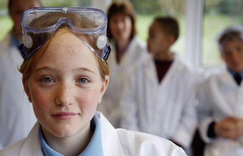 girl in chemistry lab with goggles